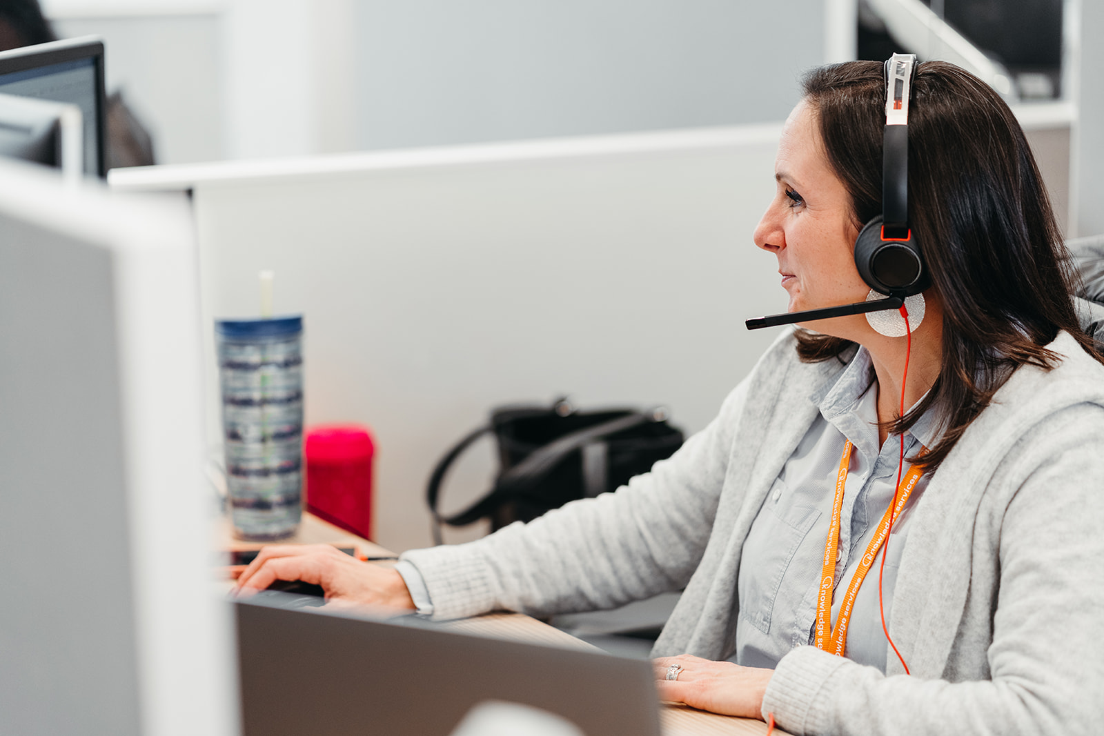 image of man sitting at a desk smiling