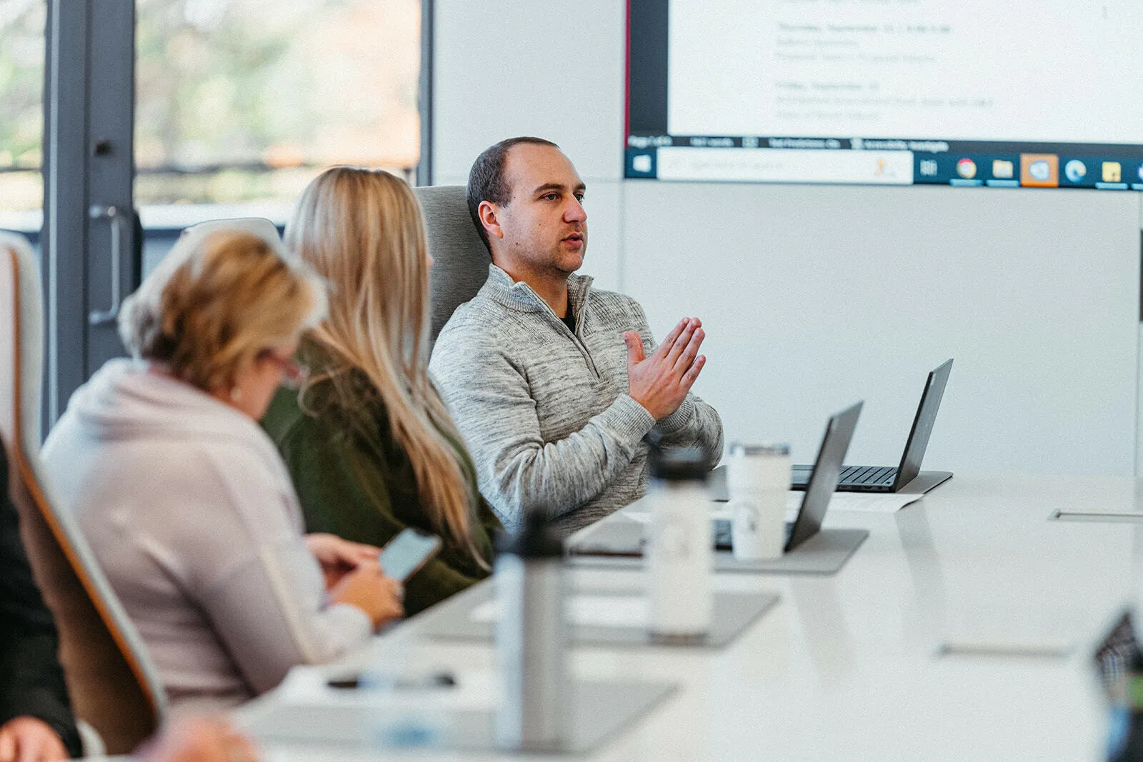 Survey Management Solutions Image of two woman having a discussion at a table